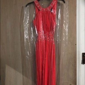 Watermelon colored halter open back prom dress